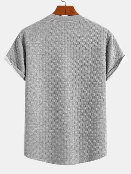 Jacquard T-Shirt mit Schachbrett-Muster und Bogen-Saum