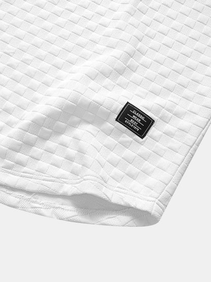 Jacquard T-Shirt mit Schachbrett-Muster und Bogen-Saum